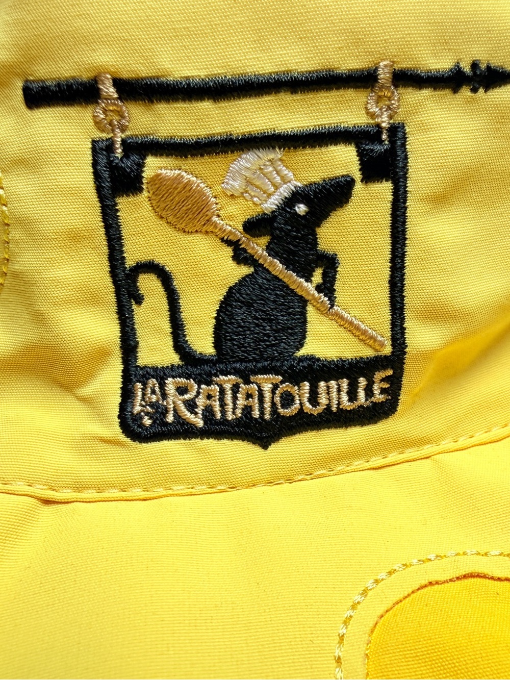 Disney Yellow Ratatouille Embroidered Puffer Detail